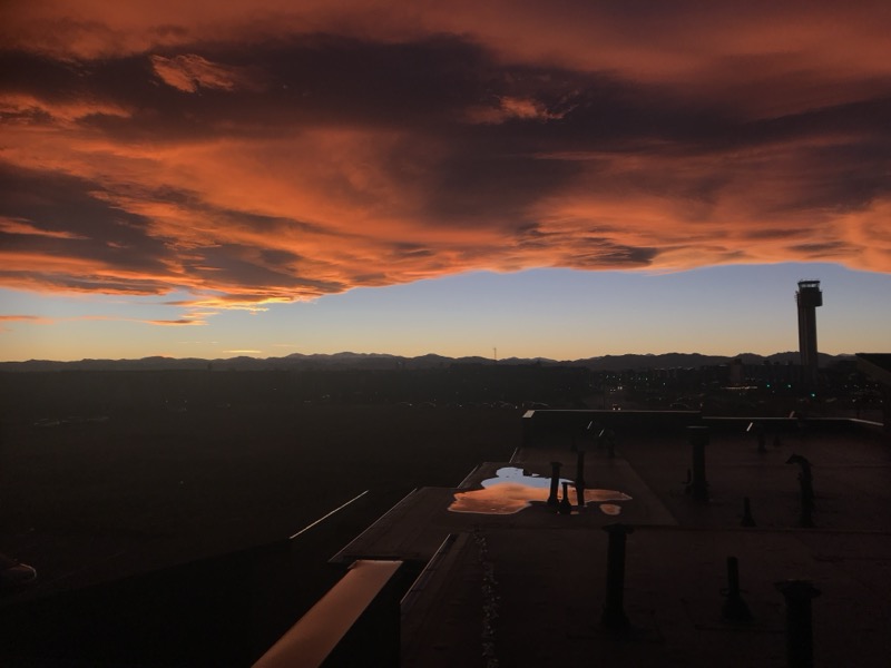 Sunset from a Denver rooftop with Rocky Mountain silhouette
